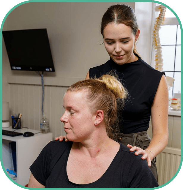 chiropractor gives adjustment to patient